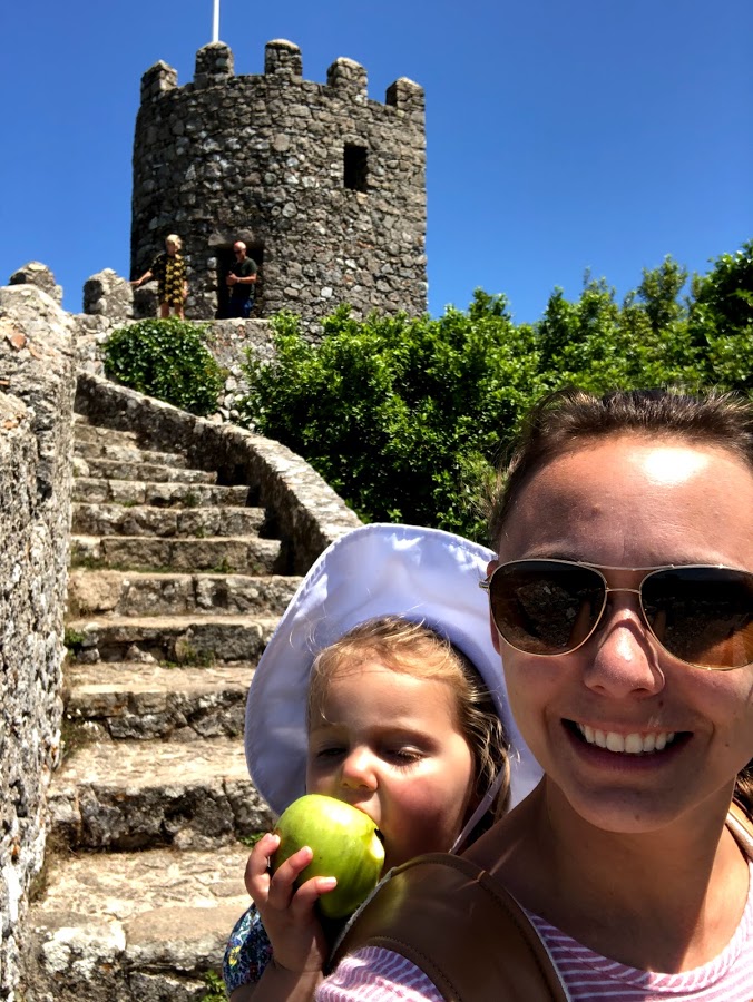 Summer and her daughter taking a selfie on the stone steps of Castelo dos Mouros
