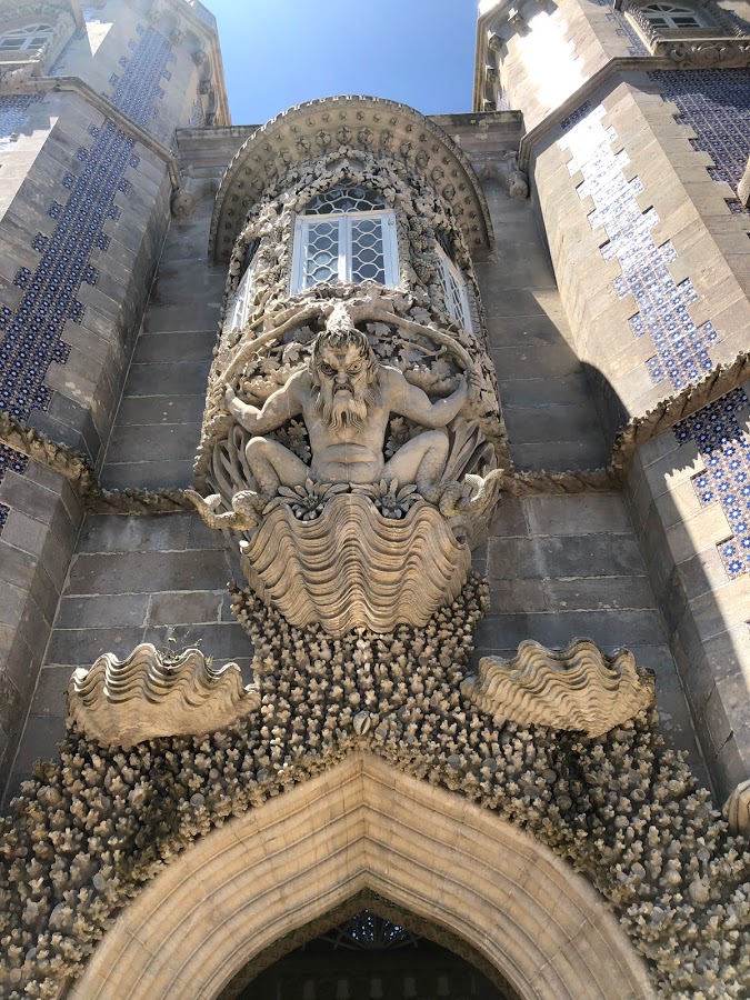 Carved Triton archway on the facade of Pena Palace in Sintra