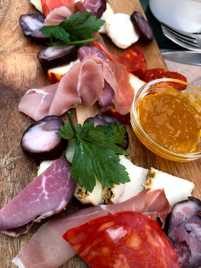 Board of cured meats and cheese at dinner in Guimarães
