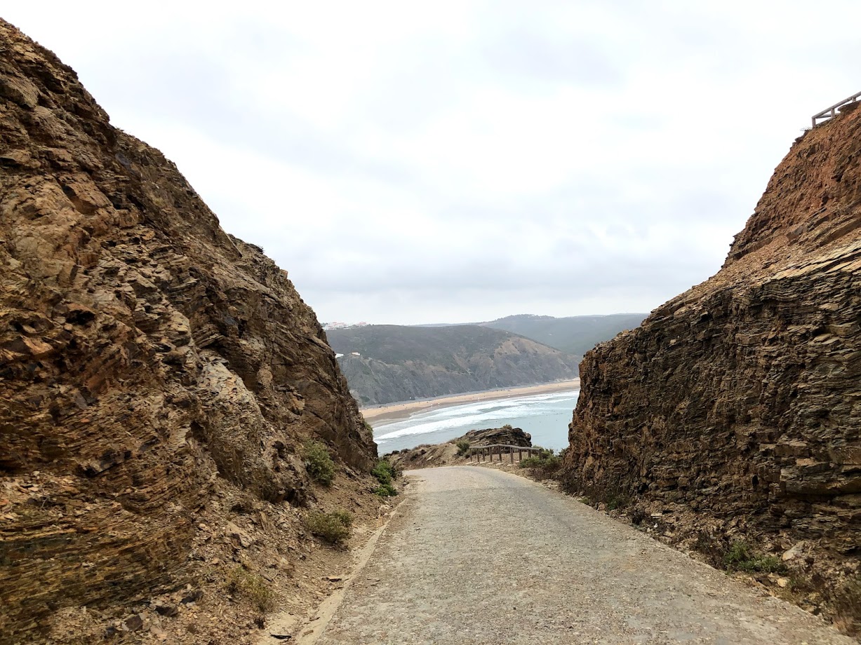 Steep road down to the fishing harbor at Portinho da Arrifana