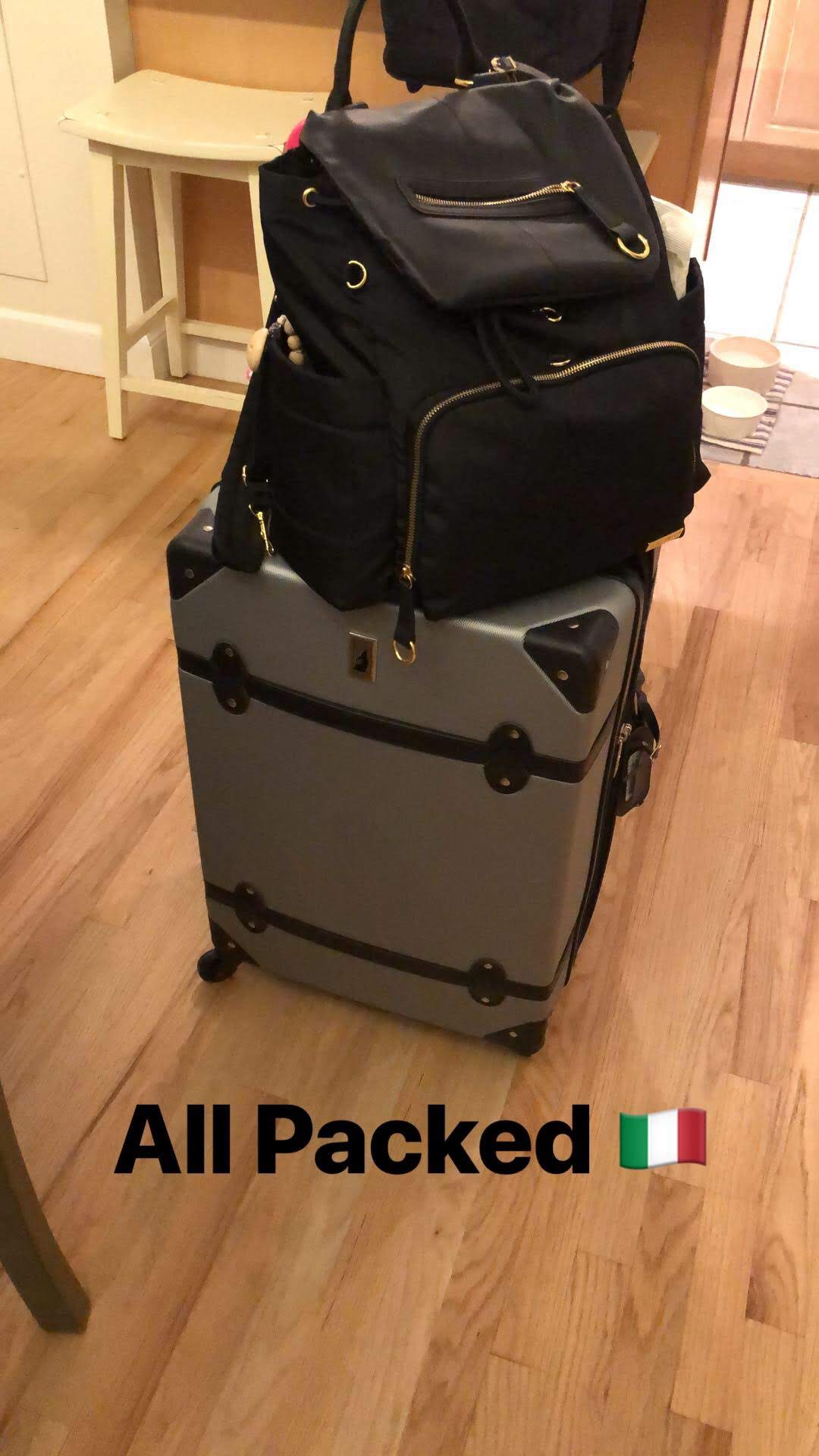 Suitcase and backpack packed for Italy
