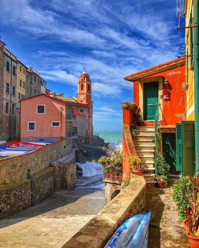 Pastel houses and the church tower in Tellaro
