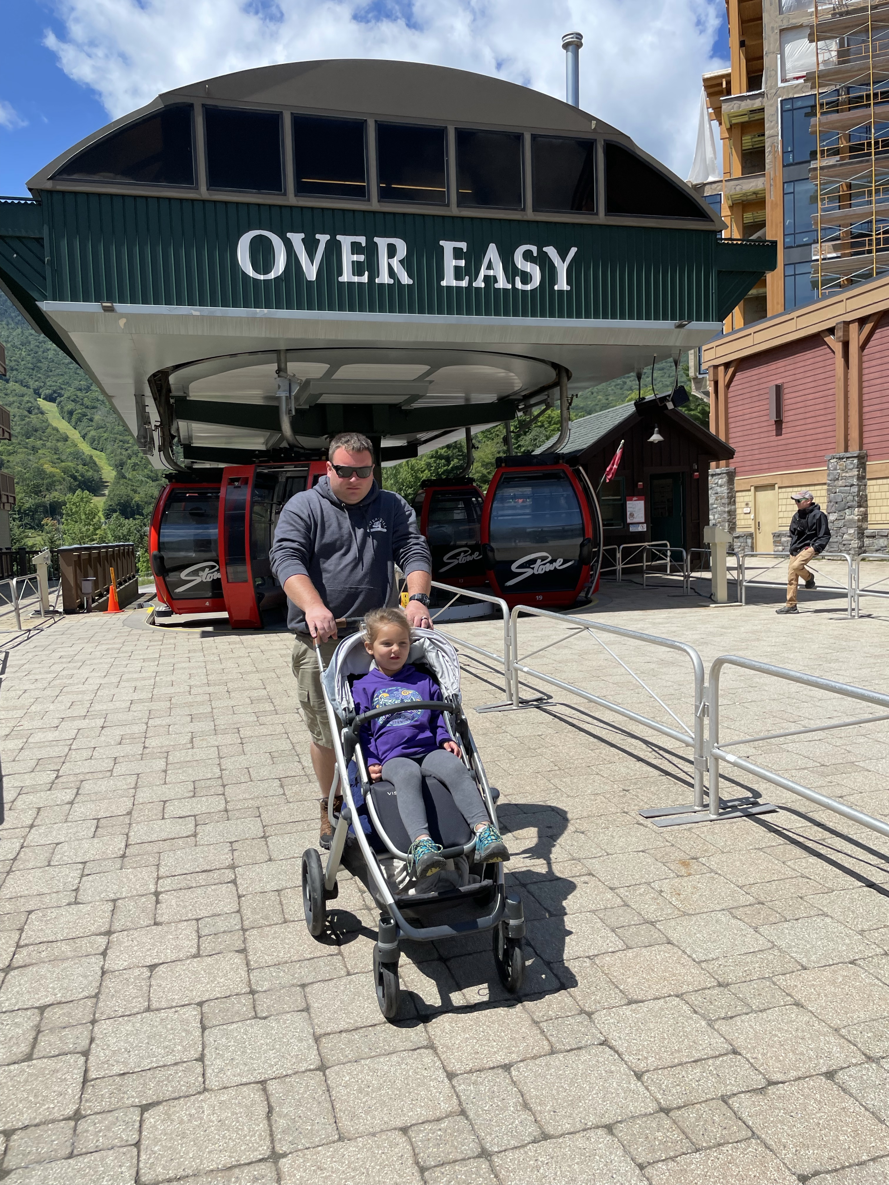 Pushing the stroller off the Over Easy gondola in Stowe