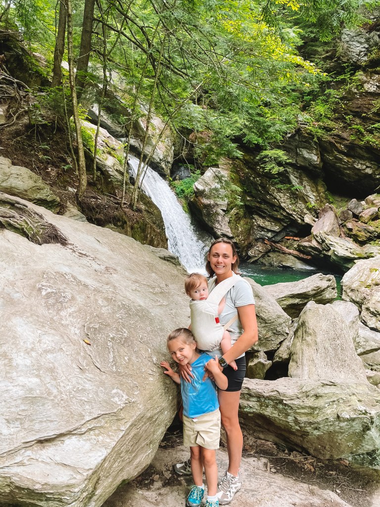 Summer and her kids by a waterfall on a summer hike near Stowe, Vermont